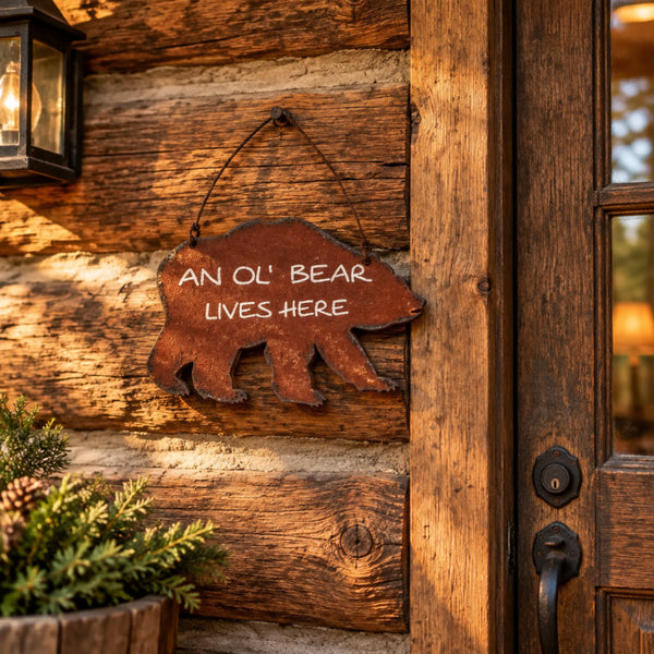 an ol bear lives here tin sign