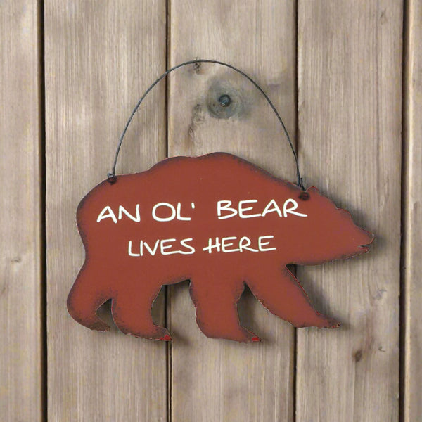 an ol bear lives here tin sign