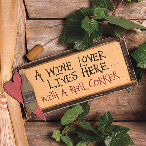 a wine lover lives here sign