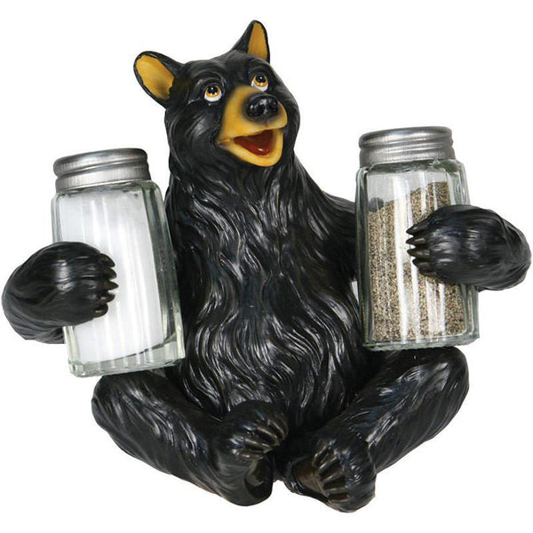 black bear holding salt and pepper shakers