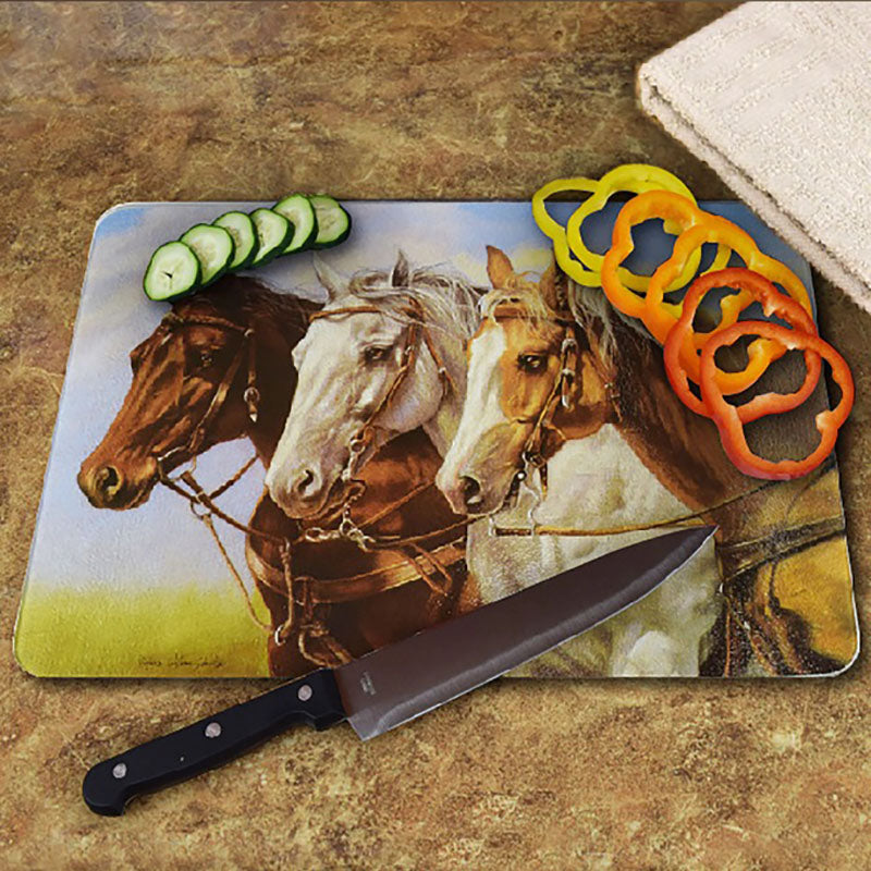 three of a kind horses glass cutting board
