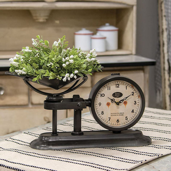 antiqued balance scale with clock