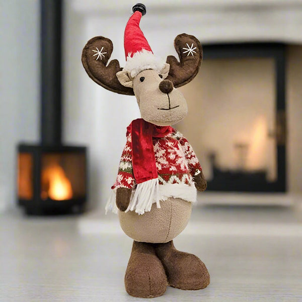 nordy the sweater wearing reindeer figurine