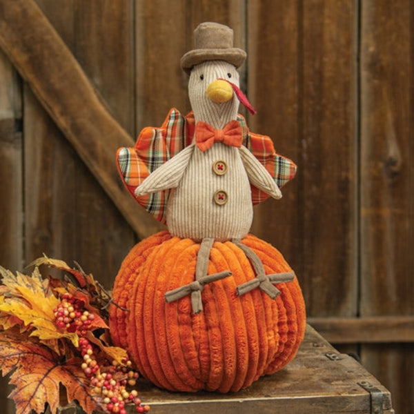 plaid turkey on pumpkin plush figurine
