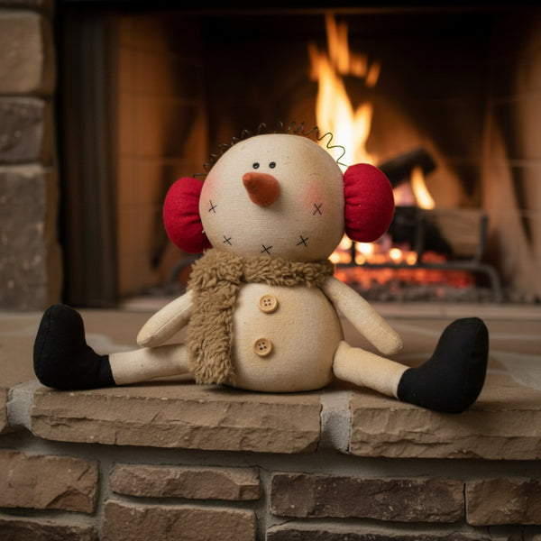 sitting snowman with earmuffs figurine