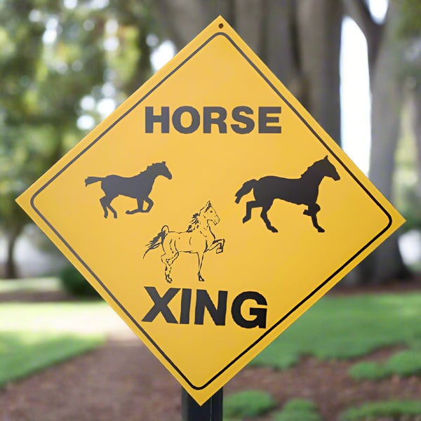 three horse crossing road sign