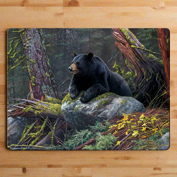 black bear taking a break glass cutting board